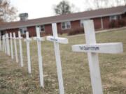 White crosses on the lawn of Good Samaritan Society nursing home Dec. 8, 2020, in Canton, S.D., commemorate residents who have died in recent weeks of the coronavirus.