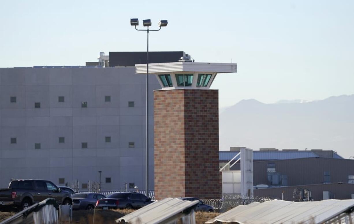 The guard tower stands near the Colorado Department of Corrections Denver Reception and Diagnostic Center Tuesday, Dec. 8, 2020, in east Denver. Amber Johnson of Fayetteville, Ark., is fighting for vaccination against the coronavirus for her 63-year-old father, Ronald, who is an inmate in the prison.