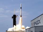 SpaceX Falcon 9, with NASA astronauts Doug Hurley and Bob Behnken in the Dragon crew capsule, lifts off from the Kennedy Space Center in Cape Canaveral, Fla., on May 30.