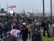 A few hundred protesters march down Highway 99 in Hazel Dell, the latest in a string of demonstrations since Kevin E. Peterson Jr. was fatally shot by police on Oct. 29.