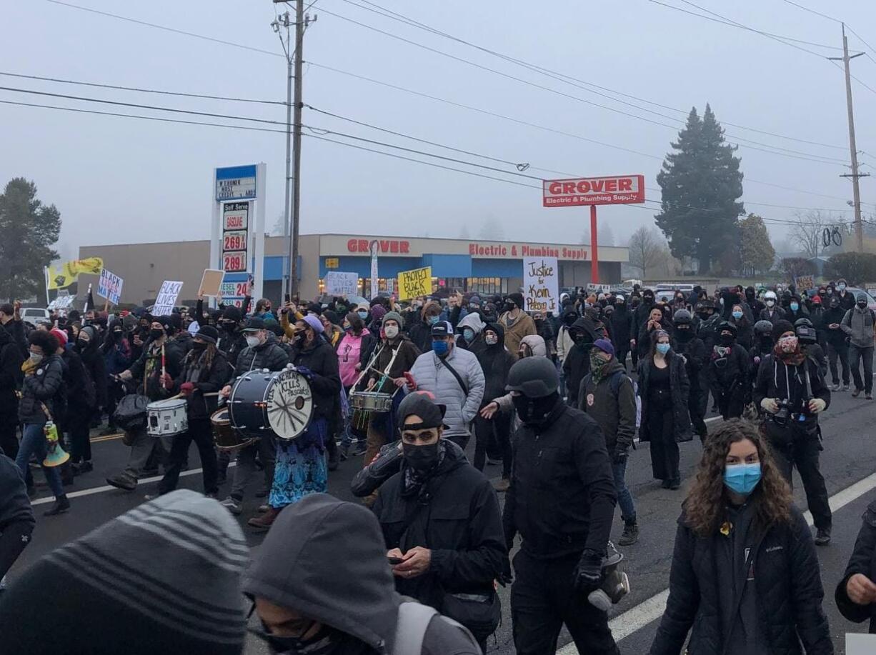 A few hundred protesters march down Northeast 78th Street in Hazel Dell, the latest in a string of demonstrations since Kevin E. Peterson Jr. was fatally shot by police on Oct. 29.