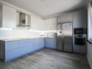 Repainting cabinets can update a kitchen without remodeling it.