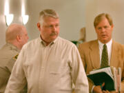 Thomas Moody, left, appears in Clark County Superior Court in 2004 with his attorney Tom Phelan.