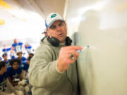 Mountain View head coach Adam Mathieson draws plays for his team during halftime of a game against Squalicum at McKenzie Stadium. As athletic director, Mathieson has been tested in a different way by the uncertainty posed by COVID-19.