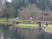 Anglers try their luck for trout at Klineline Pond in Salmon Creek Park in Vancouver recently. With most indoor recreation shut down because of the COVID-19 pandemic, more and more people are turning to fishing, hunting, and other outdoor activities.