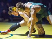 Heritage&#039;s Alex Newberry, left, wrestles at the Pacific Coast Championships in Dec. 2019. An amendment proposed by Heritage wrestling coach Erik Gonzalez would make such two-day tournaments count as one of a wrestling team&#039;s 16 allowed team events.