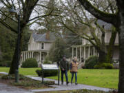 John and Trish McDermott of Vancouver walk along Officers Row.