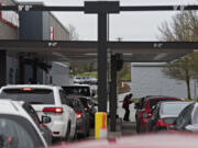 Customers form two lines as they place their orders at the new Chick-fil-A restaurant drive thru at Vancouver Mall on Thursday morning, January 7, 2021.