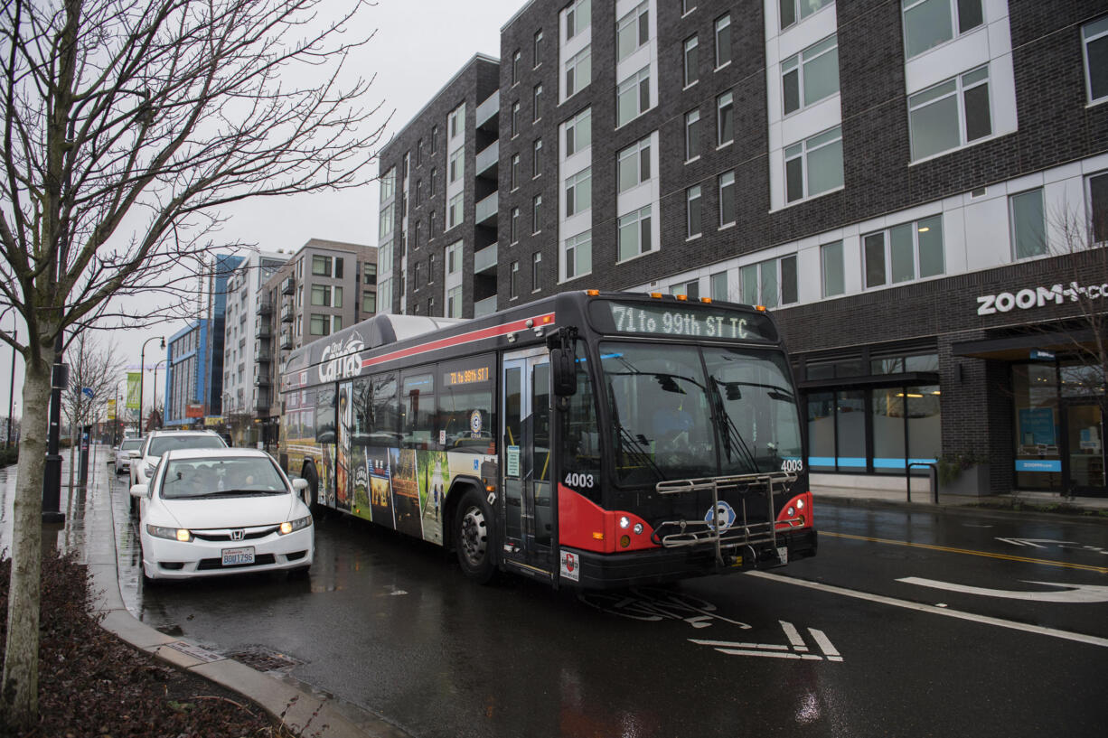 A bus on route 71 pulls out of one of the two new stops at the Waterfront Vancouver on Monday afternoon, January 11, 2021.