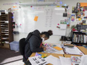 Sophomore Eboni Morris, 15, joins fellow students while working on homework in person at Legacy High School on Tuesday morning.