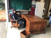 James Kasper sits at the desk once used by Judge Robert L. Harris in the Clark County Courthouse. The desk is being donated to Kasper by retired pastor Michael White for Kasper to use at a soon-to-open recovery cafe in Hazel Dell that was once the Ice House Bar &amp; Grill. White purchased the desk set at an auction some 30 years ago.