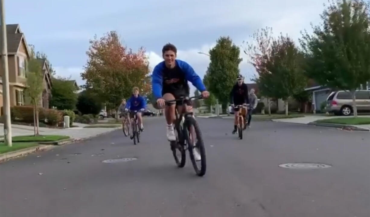 RIDGEFIELD: The opening of Spudder Night Live features Associated Student Body students socially distanced on their bikes.