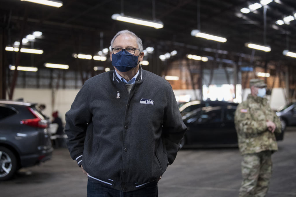 Gov. Jay Inslee speaks to members of the media during a tour of the mass COVID-19 vaccination site at the Clark County Fairgrounds on Thursday morning, January 28, 2021.