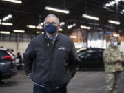 Gov. Jay Inslee speaks to members of the media during a tour of the mass COVID-19 vaccination site at the Clark County Fairgrounds on Thursday morning, January 28, 2021.