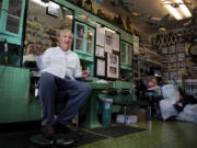 Now-retired Kelso barber Bill Ammons sits in the salon chair at his shop, Pacific Barber Shop, in June 2019.