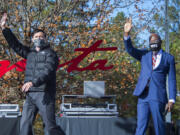 Jon Ossoff, left, and Raphael Warnock wave to the crowd during a campaign rally in Augusta, Ga., Monday, Jan. 4, 2021. Democrats Ossoff and Warnock are challenging incumbent Republican Senators David Perdue and Kelly Loeffler in a runoff election on Jan. 5.