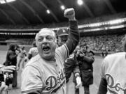 Los Angeles Dodgers manager Tom Lasorda celebrates after the Dodgers beat the Montreal Expos for the National League title in Montreal, in this Monday, Oct. 19, 1981, file photo. Tommy Lasorda, the fiery Hall of Fame manager who guided the Los Angeles Dodgers to two World Series titles and later became an ambassador for the sport he loved during his 71 years with the franchise, has died. He was 93. The Dodgers said Friday, Jan. 8, 2021, that he had a heart attack at his home in Fullerton, Calif.