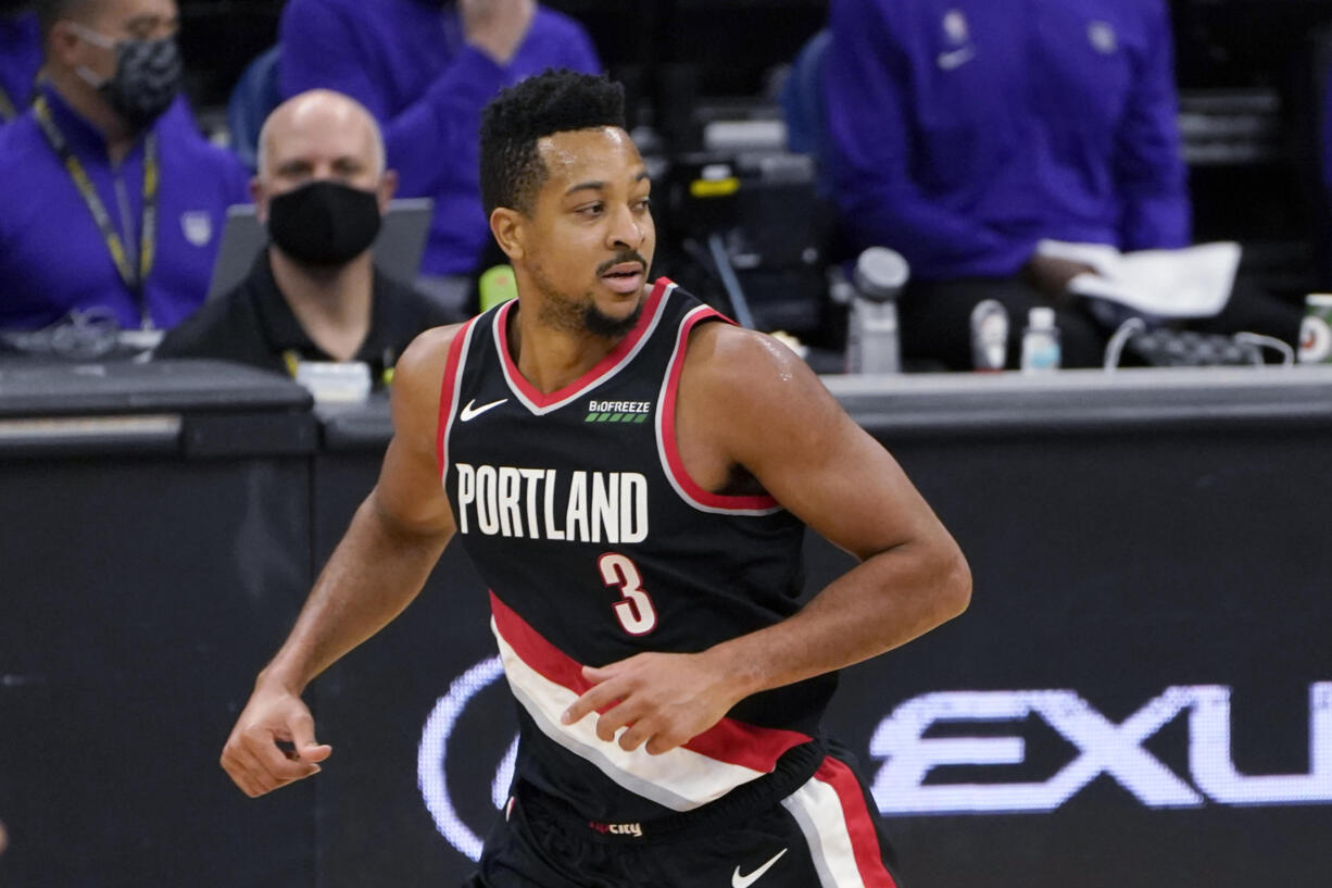 Portland Trail Blazers guard CJ McCollum runs to the other end of the court after scoring against the Sacramento Kings during the second half of an NBA basketball game in Sacramento, Calif., Saturday, Jan. 9, 2021. The Trail Blazers won 125-99.