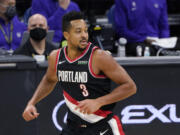 Portland Trail Blazers guard CJ McCollum runs to the other end of the court after scoring against the Sacramento Kings during the second half of an NBA basketball game in Sacramento, Calif., Saturday, Jan. 9, 2021. The Trail Blazers won 125-99.