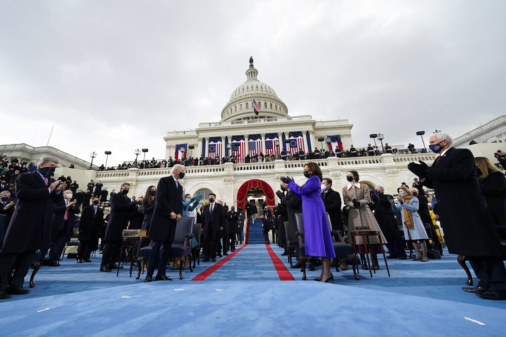 Vice President-elect Kamala Harris applauds as President-elect Joe Biden arrives for the 59th Presidential Inauguration at the U.S. Capitol in Washington, Wednesday, Jan. 20, 2021.