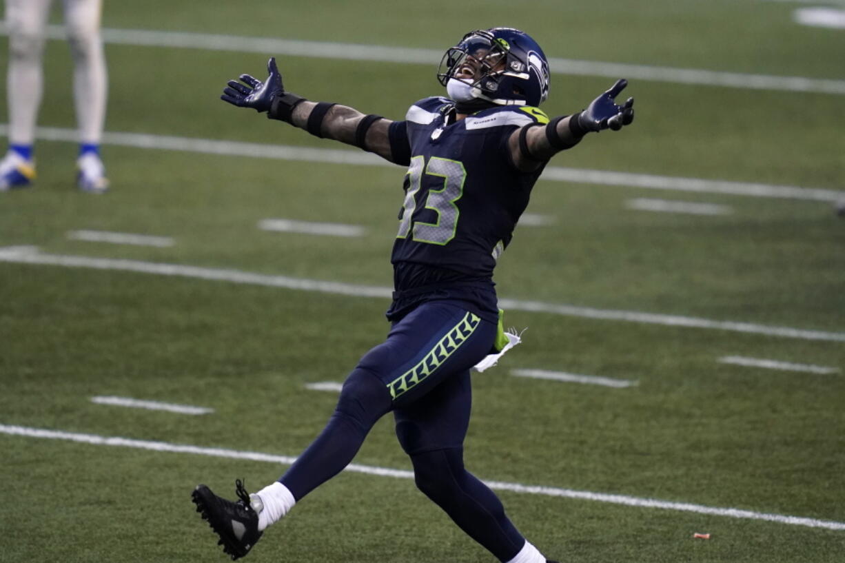 Seattle Seahawks strong safety Jamal Adams (33) reacts to a play against the Los Angeles Rams .