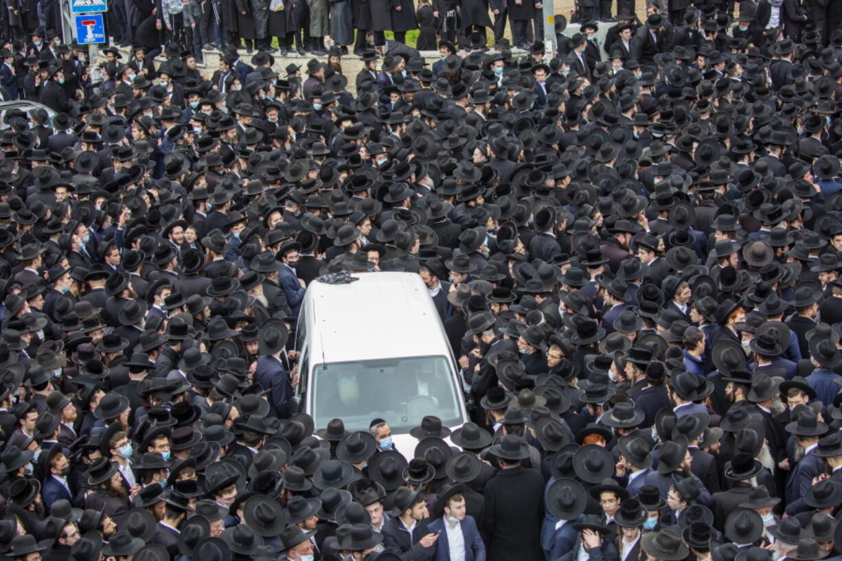 Thousands of ultra-Orthodox Jews participate in the funeral for prominent rabbi Meshulam Soloveitchik, in Jerusalem, Sunday, Jan. 31, 2021. The mass ceremony took place despite the country&#039;s health regulations banning large public gatherings, during a nationwide lockdown to curb the spread of the coronavirus.