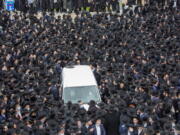 Thousands of ultra-Orthodox Jews participate in the funeral for prominent rabbi Meshulam Soloveitchik, in Jerusalem, Sunday, Jan. 31, 2021. The mass ceremony took place despite the country&#039;s health regulations banning large public gatherings, during a nationwide lockdown to curb the spread of the coronavirus.