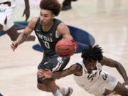 Washington State guard Isaac Bonton (10) is fouled by California guard Joel Brown (1) during the second half of an NCAA college basketball game Thursday, Jan. 7, 2021, in Berkeley, Calif.