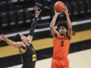 Oregon State&#039;s Ethan Thompson (5) shoots over Arizona State&#039;s Marcus Bagley (23) during the first half of an NCAA college basketball game in Corvallis, Ore., Saturday, Jan. 16, 2021.