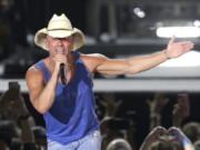 FILE - In this June 23, 2018 file photo, Kenny Chesney performs during the Trip Around the Sun Tour in Phoenix. Chesney&#039;s No Shoes Reefs organization is helping to have an artificial reef installed off of Florida&#039;s Atlantic Coast. The organization and other marine groups donated and installed 13 reef balls on the ocean floor off of Delray Beach in Palm Beach County.