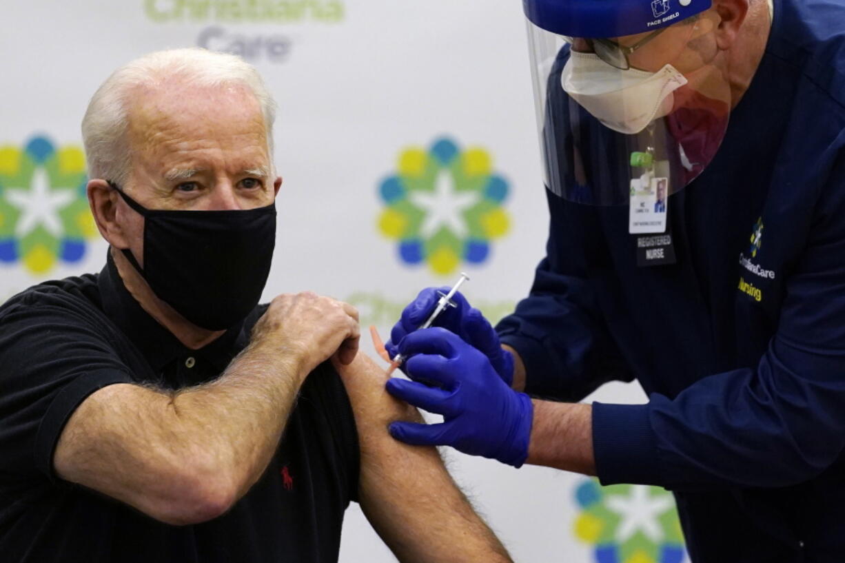 President-elect Joe Biden receives his second dose of the coronavirus vaccine at ChristianaCare Christiana Hospital in Newark, Del., Monday, Jan. 11, 2021. The vaccine is being administered by Chief Nurse Executive Ric Cuming.