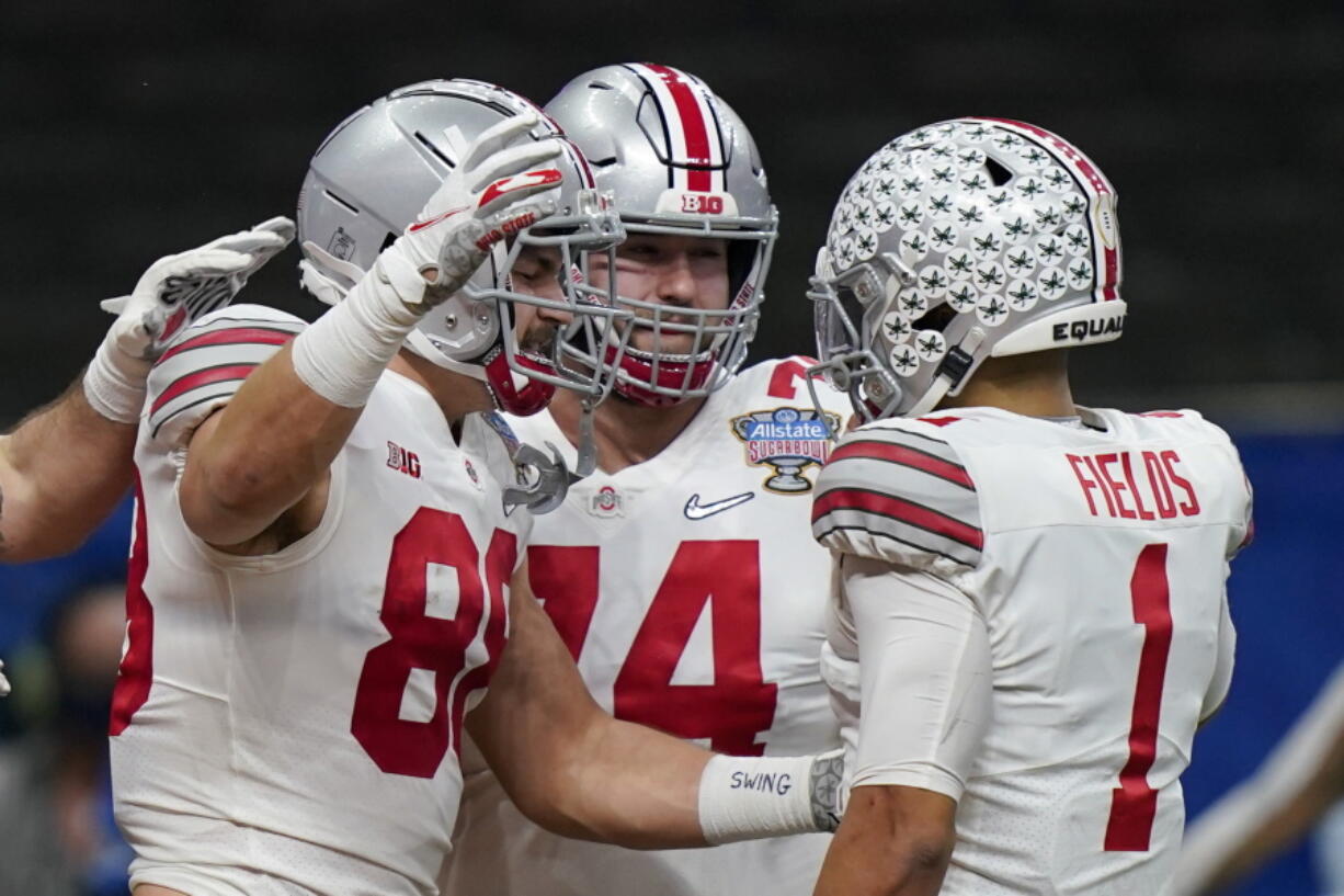 Ohio State tight end Jeremy Ruckert, left, celebrates his touchdown with quarterback Justin Fields during the first half of the Sugar Bowl NCAA college football game against Clemson Friday, Jan. 1, 2021, in New Orleans.