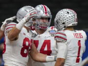 Ohio State tight end Jeremy Ruckert, left, celebrates his touchdown with quarterback Justin Fields during the first half of the Sugar Bowl NCAA college football game against Clemson Friday, Jan. 1, 2021, in New Orleans.