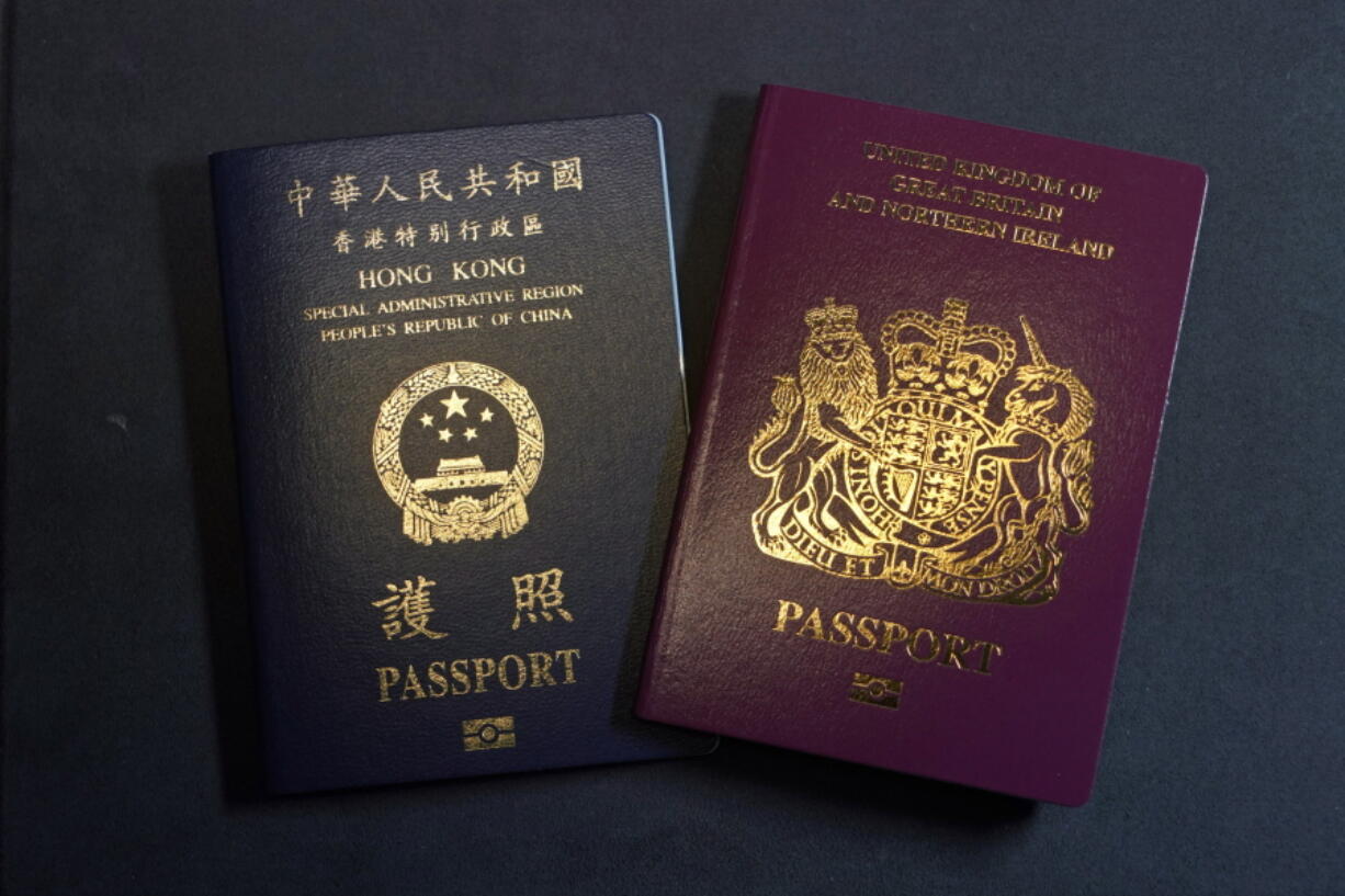 A British National Overseas passports (BNO) and a Hong Kong Special Administrative Region of the People&#039;s Republic of China passport are pictured in Hong Kong, Friday, Jan. 29, 2021. China said Friday it will no longer recognize the British National Overseas passport as a valid travel document or form of identification amid a bitter feud with London over a plan to allow millions of Hong Kong residents a route to residency and eventual citizenship.