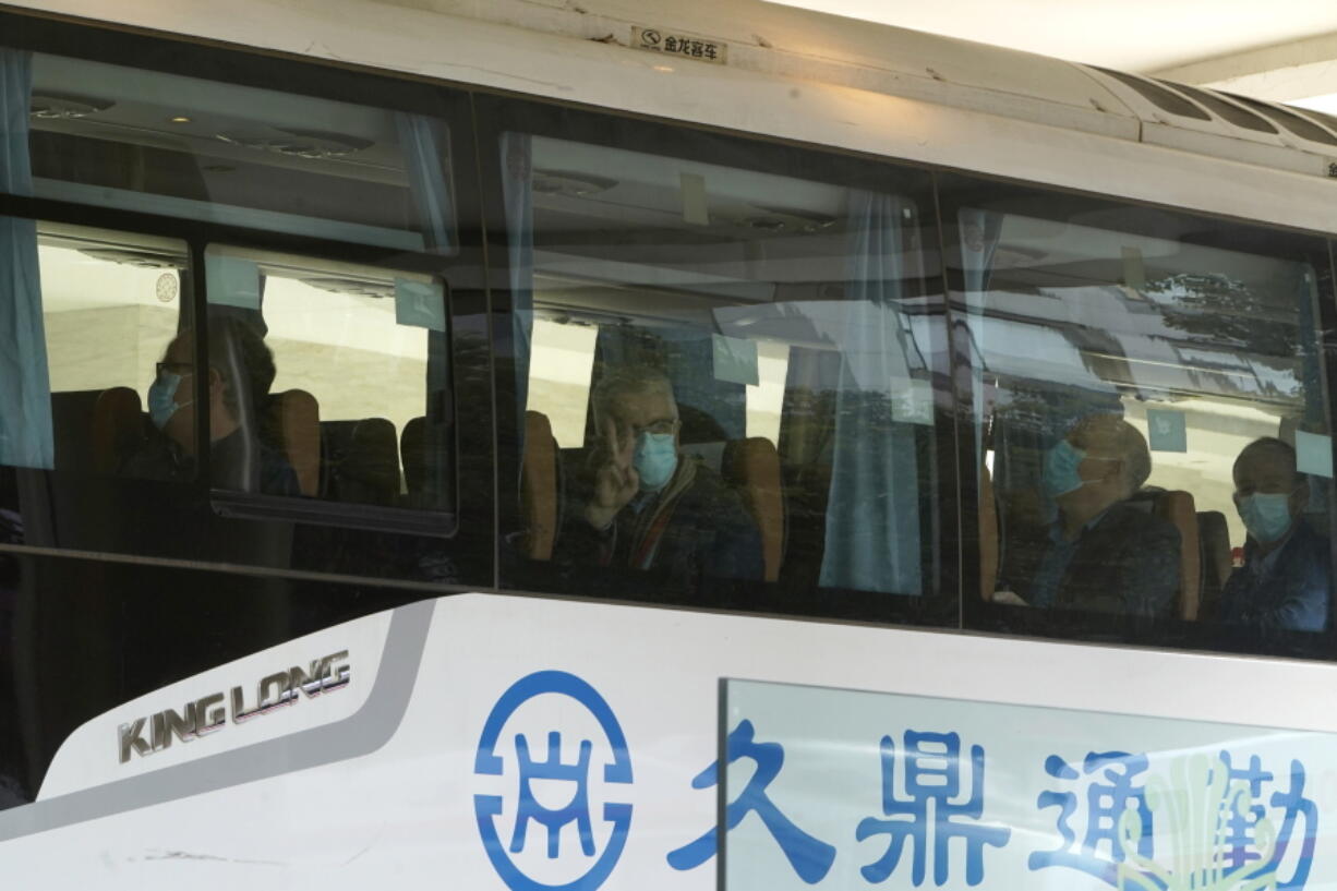 Members from the World Health Organization team of experts prepare to leave on a bus after ending their quarantine at a hotel in Wuhan in central China&#039;s Hubei province on Thursday, Jan. 28, 2021.