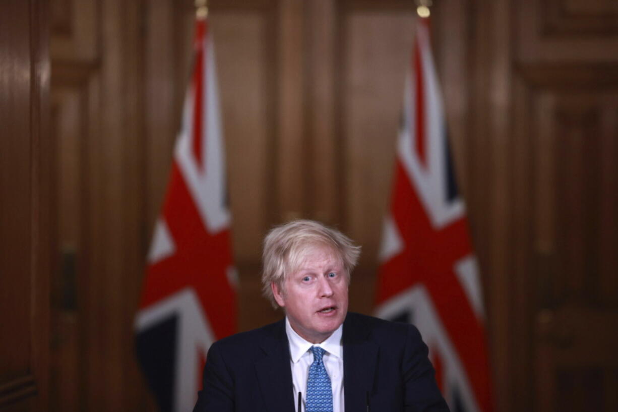 FILE - In this Jan. 5, 2021, file photo, Britain&#039;s Prime Minister Boris Johnson speaks during a news conference inside 10 Downing Street in London. World leaders, including Johnson, are condemning the storming of the U.S. Capitol by supporters of President Donald Trump.