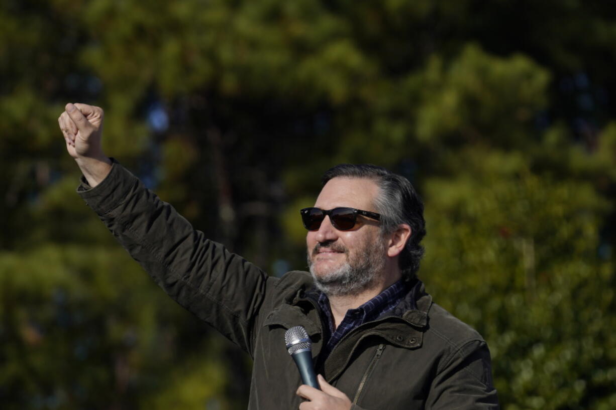 Sen. Ted Cruz, R-Texas, greets a crowd before he speaks at a campaign rally for Sen. Kelly Loeffler, R-Ga., on Saturday, Jan. 2, 2021, in Cumming, Ga.