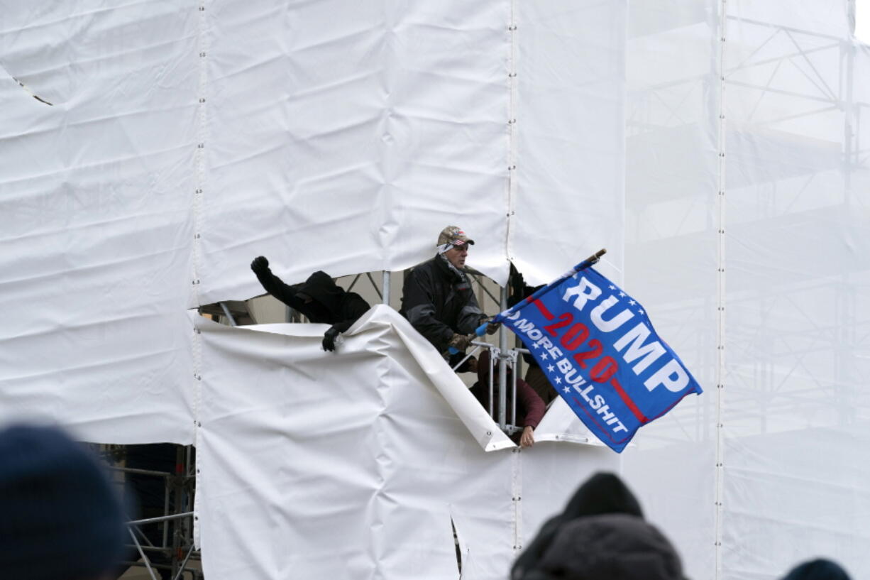 Trump supporters gather outside the Capitol, Wednesday, Jan. 6, 2021, in Washington. As Congress prepares to affirm President-elect Joe Biden&#039;s victory, thousands of people have gathered to show their support for President Donald Trump and his claims of election fraud.