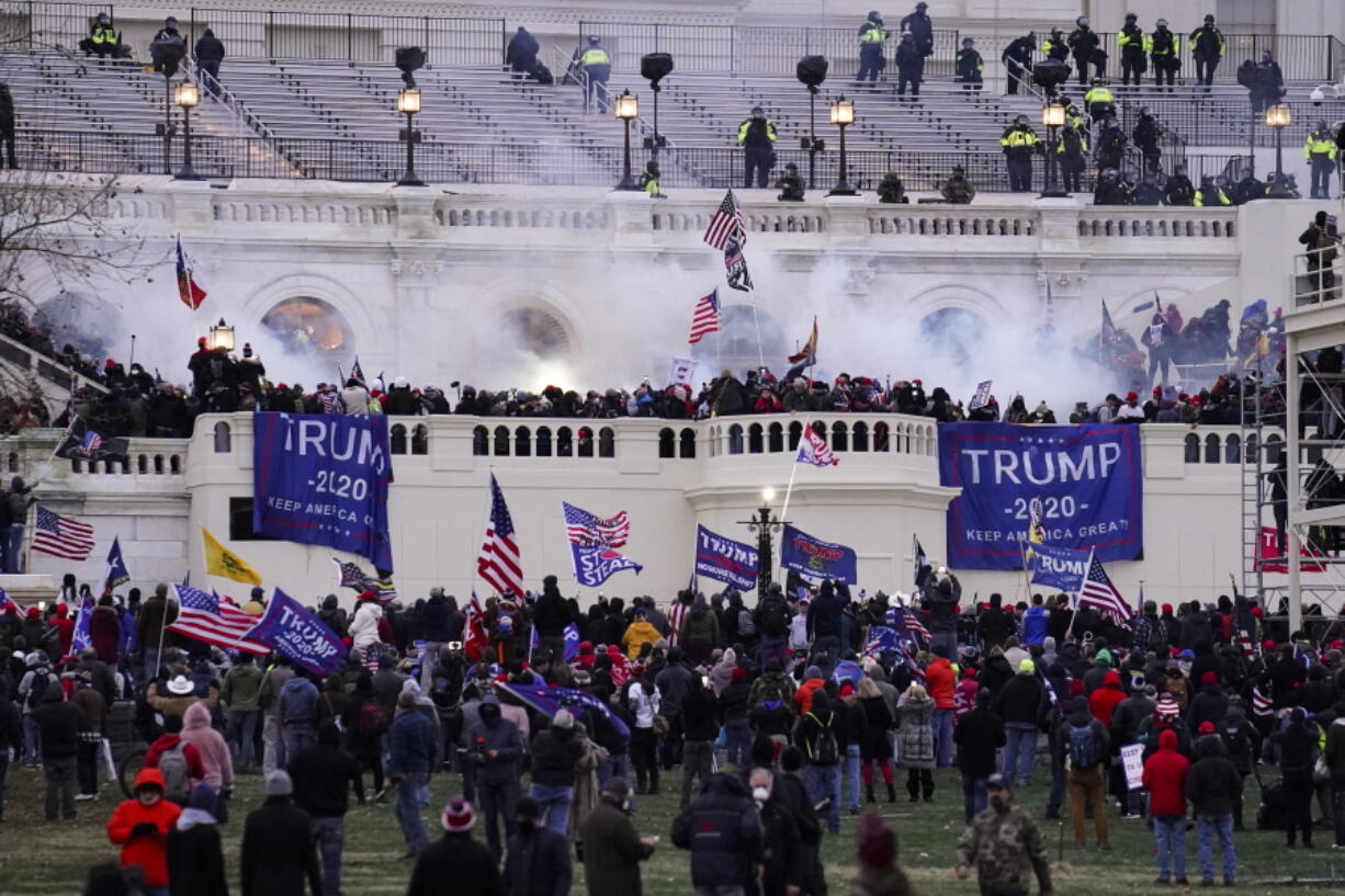 Violent protesters, loyal to President Donald Trump, storm the Capitol on Wednesday in Washington. It was a stunning day as a number of lawmakers and then the mob of protesters tried to overturn America's presidential election, undercut the nation's democracy and keep Democrat Joe Biden from replacing Trump in the White House.