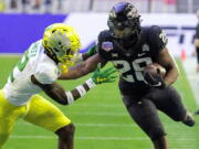 Iowa State running back Breece Hall (28) is hit by Oregon cornerback DJ James during the first half of the Fiesta Bowl NCAA college football game, Saturday, Jan. 2, 2021, in Glendale, Ariz.