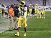 Oregon linebacker TJ Gilbert (56) leaves the field after the Fiesta Bowl NCAA college football game against Oregon, Saturday, Jan. 2, 2021, in Glendale, Ariz. Iowa State won 34-17. (AP Photo/Ross D.