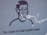 A sign promoting wearing face masks is shown on Main Street in Park City, Utah.