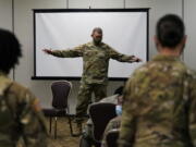 Sergeant Major of the Army Michael Grinston, center, gets feedback from soldiers about their concerns at Fort Hood, Texas, Thursday, Jan. 7, 2021. Following more than two dozen soldier deaths in 2020, including multiple homicides, the U.S. Army Base is facing an issue of distrust among soldiers.