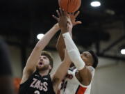 Gonzaga forward Drew Timme, left, and Pepperdine center Victor Ohia Obioha (34) reach for a rebound during the first half of an NCAA college basketball game Saturday, Jan. 30, 2021, in Malibu, Calif.