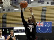 Gonzaga University guard Joel Ayayi, drives to the basket during the first half of an NCAA college basketball game against Portland in Portland, Ore., Saturday, Jan. 9, 2021.