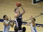 Gonzaga forward Drew Timme (2), center, shoots past San Diego forward Yavuz Gultekin (11), left, and guard Joey Calcaterra (2) during the first half of an NCAA college basketball game Thursday, Jan. 28, 2021, in San Diego.