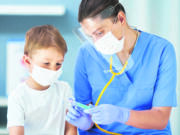 Picture of adorable little boy having doctor's appointment