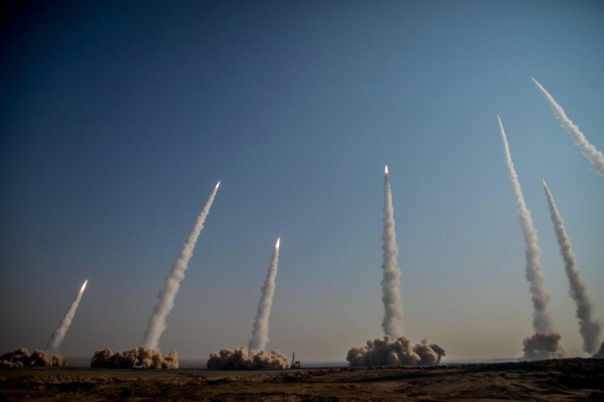 In this photo released on Friday, Jan. 15, 2021, by the Iranian Revolutionary Guard, missiles are launched in a drill in Iran. Iran&#039;s paramilitary Revolutionary Guard forces on Friday held a military exercise involving ballistic missiles and drones in the country&#039;s central desert, state TV reported, amid heightened tensions over Tehran&#039;s nuclear program and a U.S. pressure campaign against the Islamic Republic.