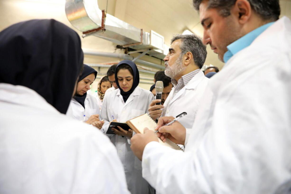 In this photo released by the Atomic Energy Organization of Iran, spokesman of the organization Behrouz Kamalvandi, center, briefs the media while visiting Fordo nuclear site near Qom, south of Tehran, Iran Saturday, Nov. 9, 2019. Joe Biden has an Iran problem. And, it&#039;s getting more complicated by the day.