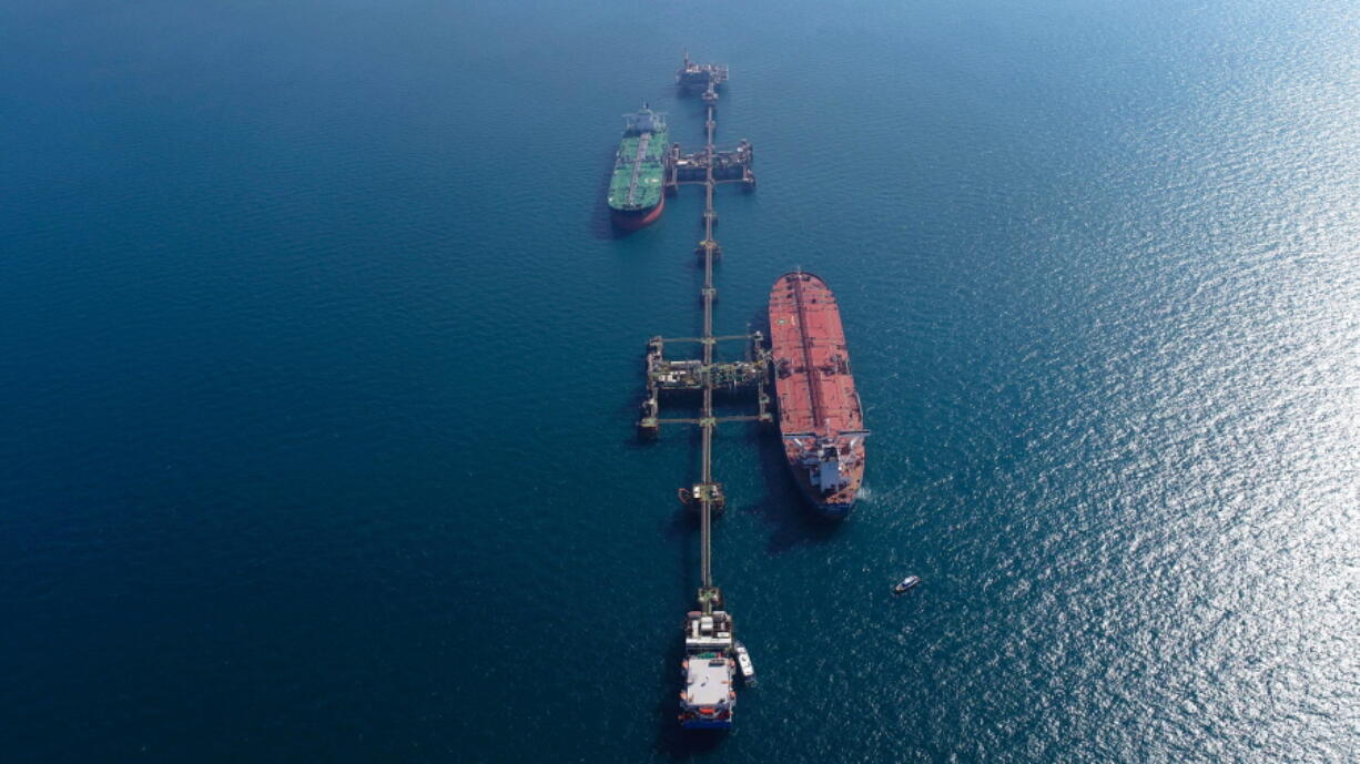 An aerial photo shows oil tankers load crude oil at Iraq&#039;s Al-Basra Offshore Terminal in Basra, Iraq, Sunday, Dec. 27, 2020.